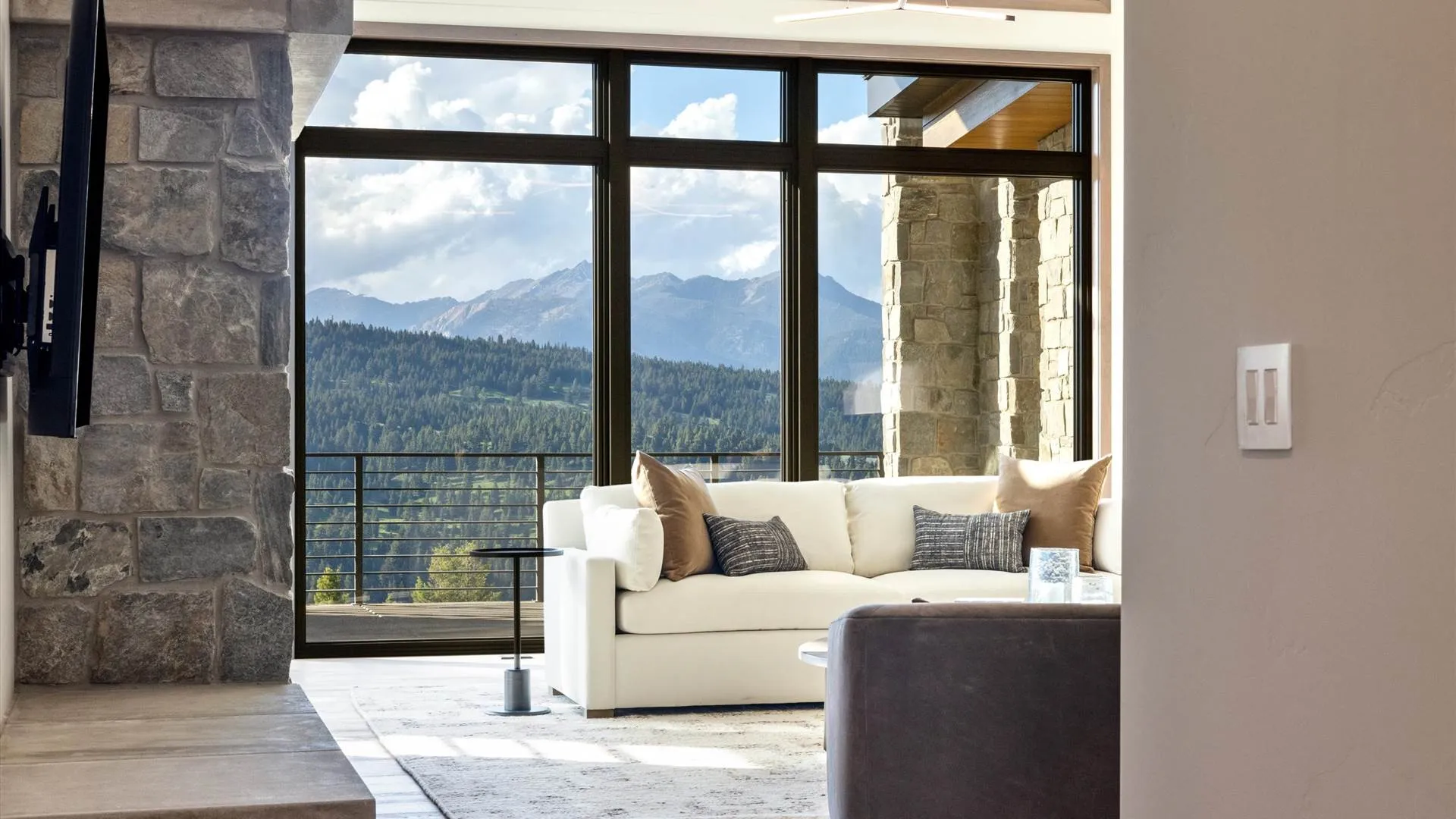 Large window in a luxury living room by Hartman Homes